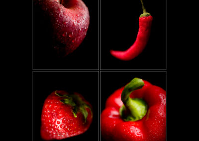 Maçã, pimento e morango vermelhos sobre fundo negro captados por Humberto Barbosa em Porto — fotografia publicitária de produto alimentar